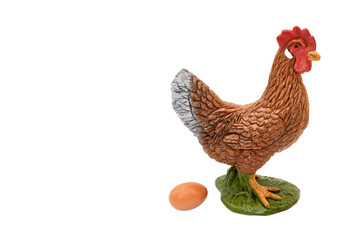 miniature figurine of a red hen with an egg