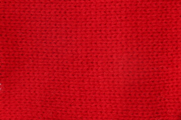Red sweater fabric close up 