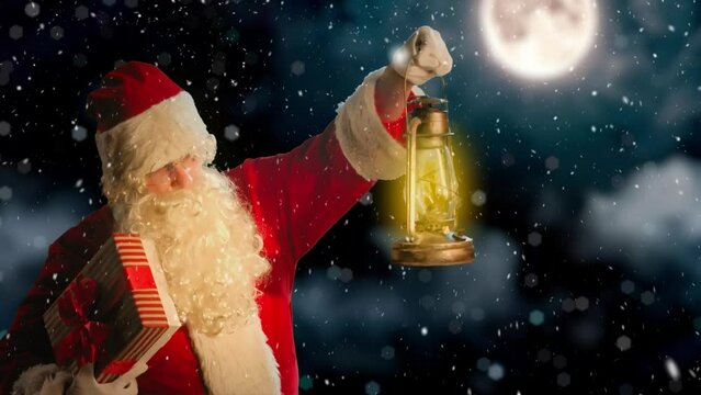 Santa Claus With Lantern In Snowy Night against the background of the night sky.