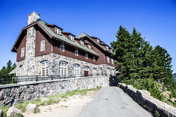 Fototapeta na wymiar Crater Lake Lodge in Crater Lake National Park on a clear summer day with pine trees and walkway.