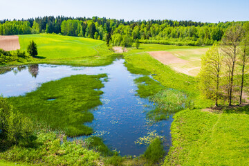 Lakes among green meadows and hills in Suwalski Landscape Park, Podlasie, Poland