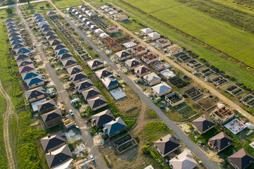 Construction of a suburban neighborhood of cottages. Aerial view.
