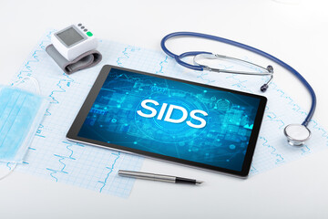 Close-up view of a tablet pc with medical abbreviation