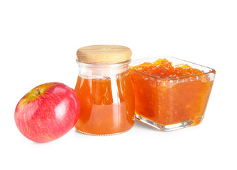Jar and glass bowl of sweet apple jam on white background