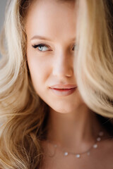 Naklejka premium Portrait of a beautiful young blonde woman. Women's beauty. 