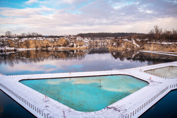 Aerial view of popular location Zakrzówek Quarry, Krakow. Floating swimming pool with clear water...