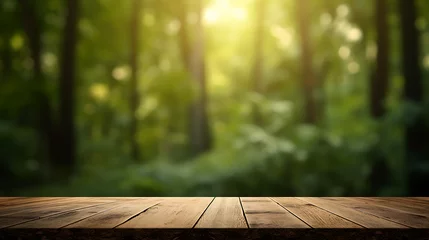 Foto op Aluminium Empty wooden table with forest in blurry bokeh background © Tam