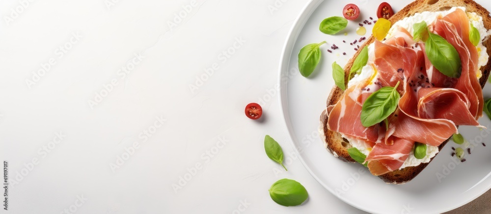 Aufkleber breakfast or brunch open sandwich with prosciutto or jamon on white plate mediterranean appetizer to