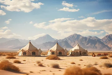 Fotobehang camping tents in the middle of the desert with the mountains at back © DailyLifeImages