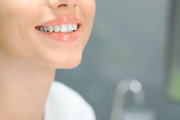 Obraz premium Beautiful Smile. Closeup Portrait Of Beautiful Happy Young Woman With Perfect White Teeth