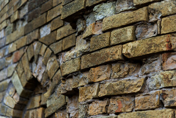 Destroyed brick wall of a house close-up. war in Ukraine