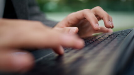 Man hands typing keyboard at city closeup. Unknown student using laptop macro © stockbusters