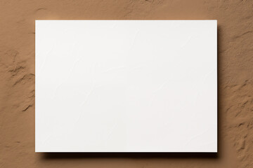 Blank white card mock-up over textured background