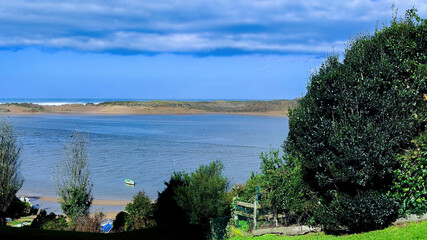 photographing a landscape on the beach with boats on the sand on a sunny day