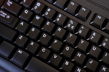 close-up black keyboard, office environment, computer peripherals, computer technologies and the IT...