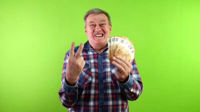Man holding cash 50 euro and doing victory sign.