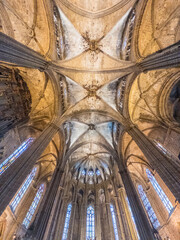 Interior the historic Barcelona Cathedral, also known as the Cathedral of the Holy Cross and Sait Eulalia.  The cathedral is located in the Gothic Quarter of Barcelona, Spain