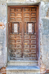 Old weathered wooden doorway in historic Spain