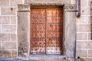 Old wooden weathered doorway in historic spain