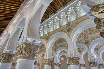 Beautiful old moorish or horseshoe arches in the Synagogue of Santa María la Blanca.  The building...