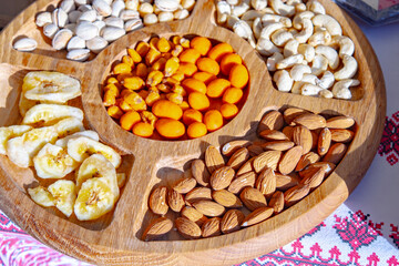 Fresh almonds nut on a wooden table in the summer garden