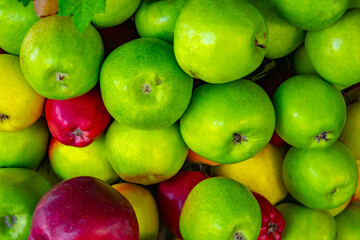 Red and green apples. Background of ripe apples.