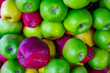 Red and green apples. Background of ripe apples.