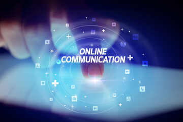 Finger touching tablet with social media icons concept