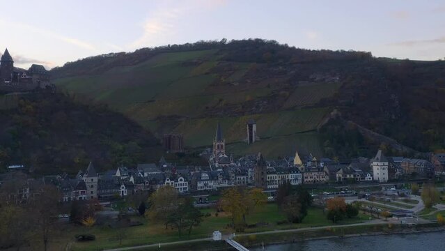 Drone aerial view of Bacharach traditional village with Rhine river at sunset in Germany
