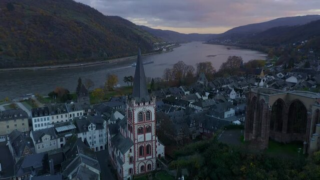 Drone aerial view of Bacharach traditional village with Rhine river at sunset in Germany