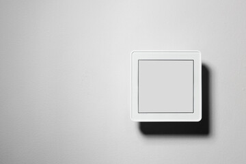 One thermostat on white wall, space for text. Smart home system
