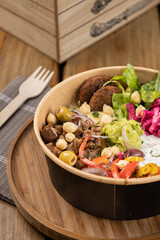 Mediterranean Bowl with, Falafel, chickpea croquettes, olives and rice
