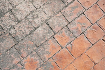 The old, peeling paint on the walkway in the park