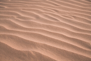 The background image of the sand texture created by the wind, erosion