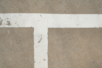 White lines, peeling paint on the cement floor of the old stadium
