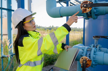 Environmental engineers work at wastewater treatment plants,Female plumber technician working at...
