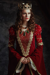 medieval queen in red dress with crown