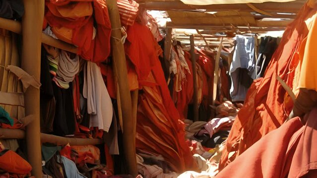 A view inside a squalid room devoid of furniture and basic amenities..