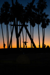 Silhouettes of people during sunset in California.