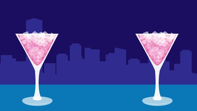 A cocktail in a glass with the night view in the background