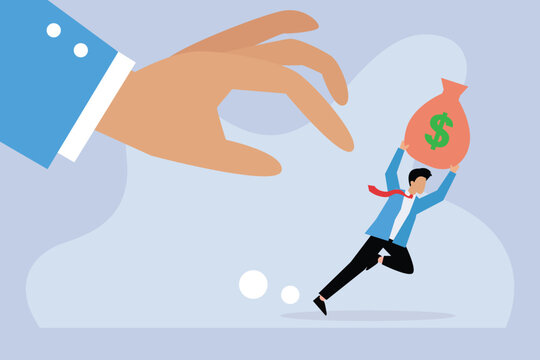 Businessman running while lifting a sack of money being chased by a big hand