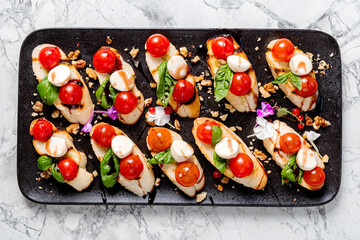 canape with tomatoes and mozzarella closeup