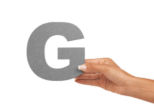 Hand of woman, capital letter G and presentation of consonant isolated on white background. Character, font and person with English alphabet typeface for communication, reading and writing in studio.
