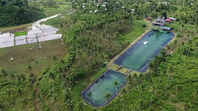 Siargao wake park with Artificial Wakeboarding Lake amid lush tropical vegetation