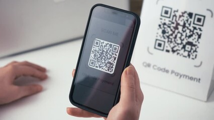 QR code online payment. Using a smartphone app, scan a QR code and pay contactless for shopping. - Powered by Adobe