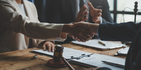 Lawyer shaking hands with businessman, investor in financial agreement, partner congratulating success or lawyer discussing contract agreement. Handshake concept. Agreement. - obrazy, fototapety, plakaty