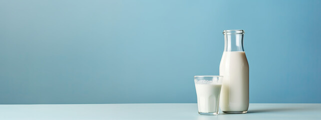 Bottle and glass of milk on isolated background - obrazy, fototapety, plakaty