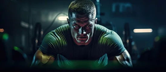 Rolgordijnen Fitness Athlete in dimly-lit gym with neon glow, undergoing training.