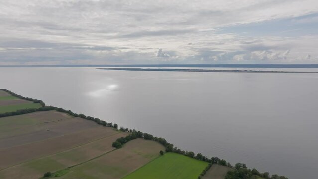 Tranquil Lake And Fields Near Brahehus Ruins Near V&auml;ttern, Sweden. Aerial Panning Shot