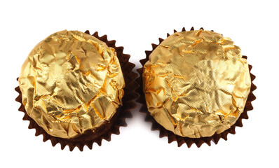 Two chocolate candies in a golden foil wrapper isolated on a white background. Elite chocolates.